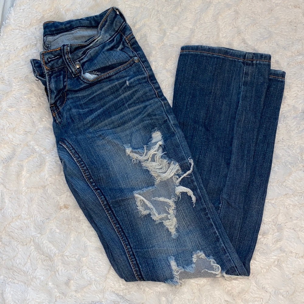 Machine ripped denim